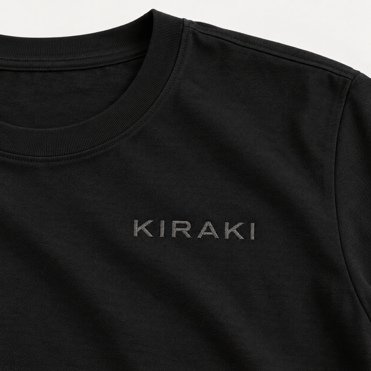Kiraki Performance 01 crew neck and tonal KIRAKI chest wordmark close-up