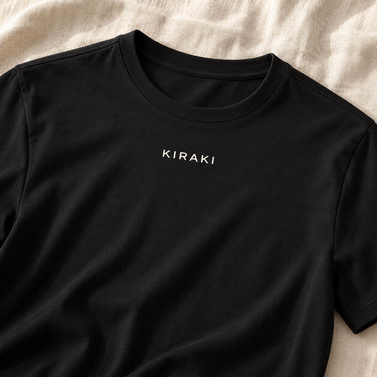 Kiraki Sleep 01 crew neckline and white KIRAKI chest wordmark close-up